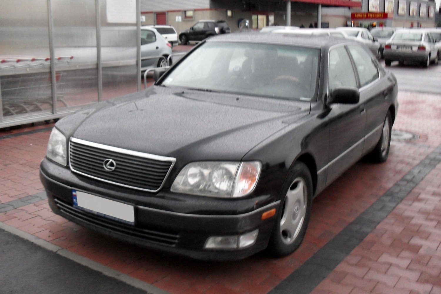 Front view of a sedan with horizontal grille and dual round headlights