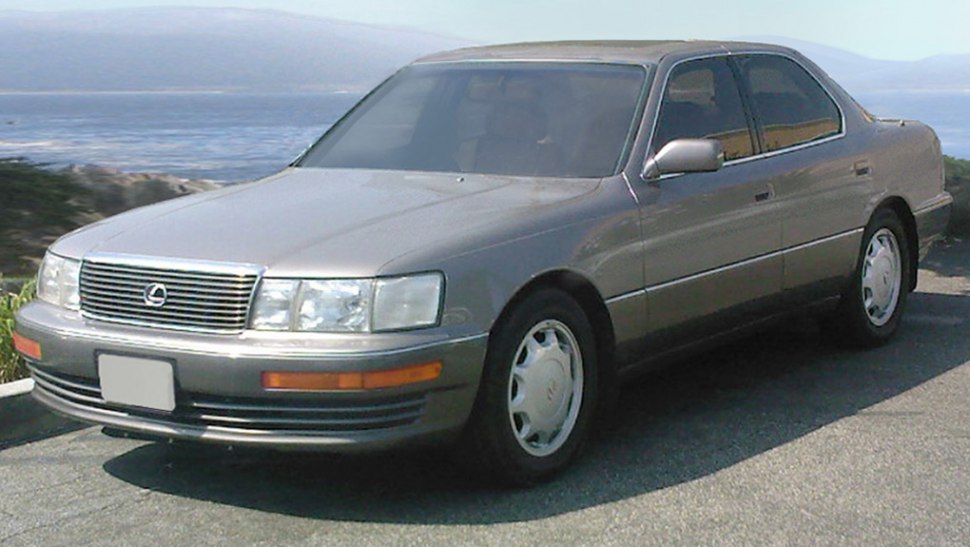 Classic sedan with chrome grille, rectangular headlights, alloy wheels