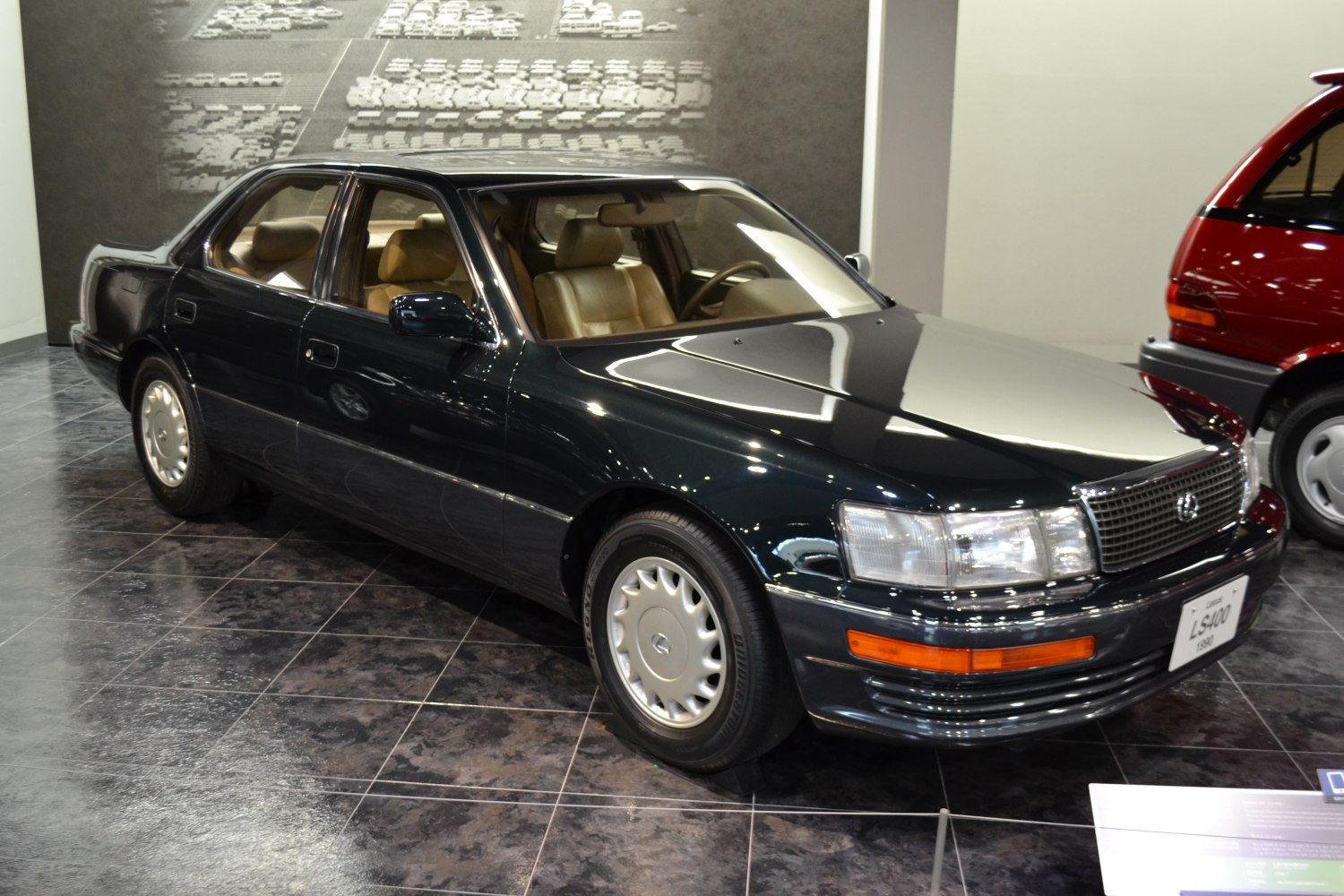Early 90s luxury sedan with distinctive grille and alloy wheels