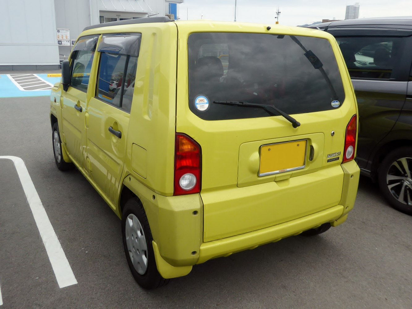 Boxy compact kei car rear with vertical taillights