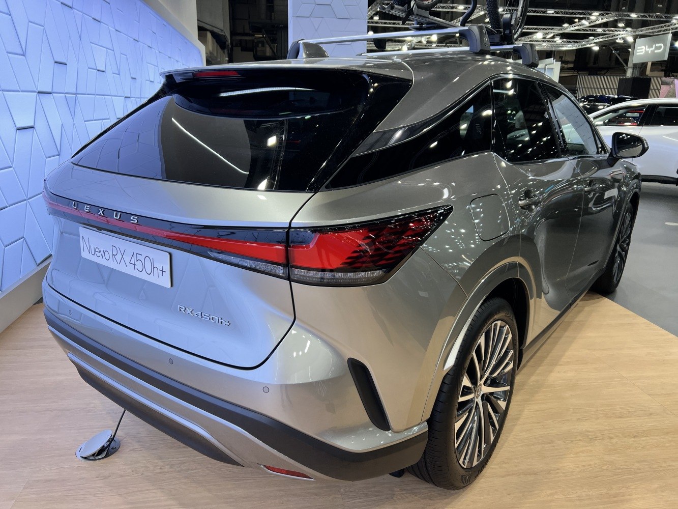 Rear view with sleek curved body and distinctive tail light design.