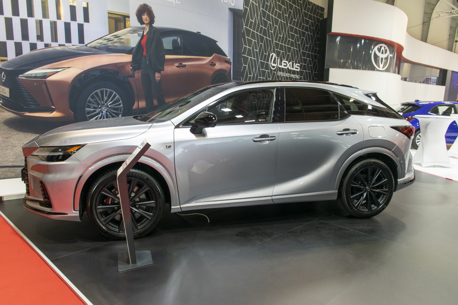 Silver SUV side profile with black alloy wheels and sleek design