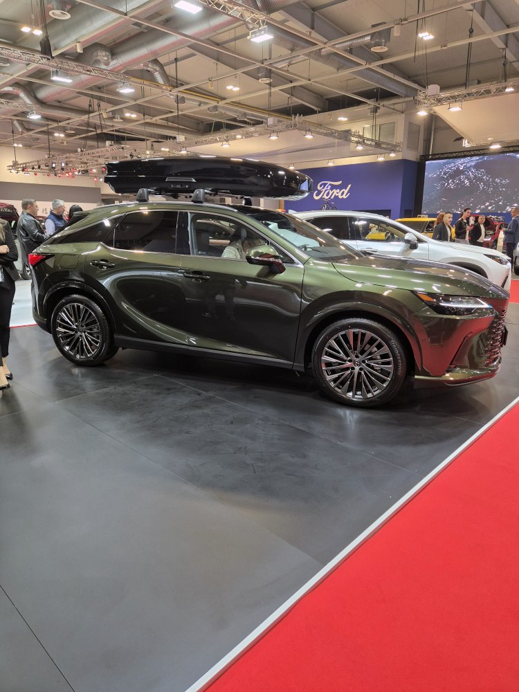 SUV with roof cargo box at auto exhibition