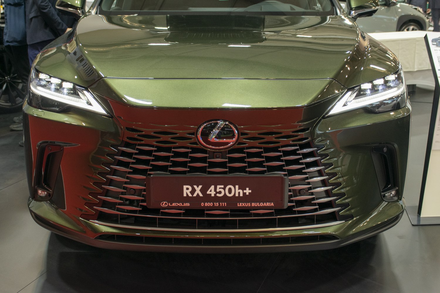 Front grille and LED headlights of a 2023 hybrid luxury SUV