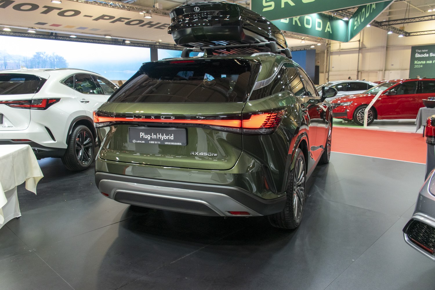 Rear view of luxury hybrid SUV with roof cargo box and LED taillights