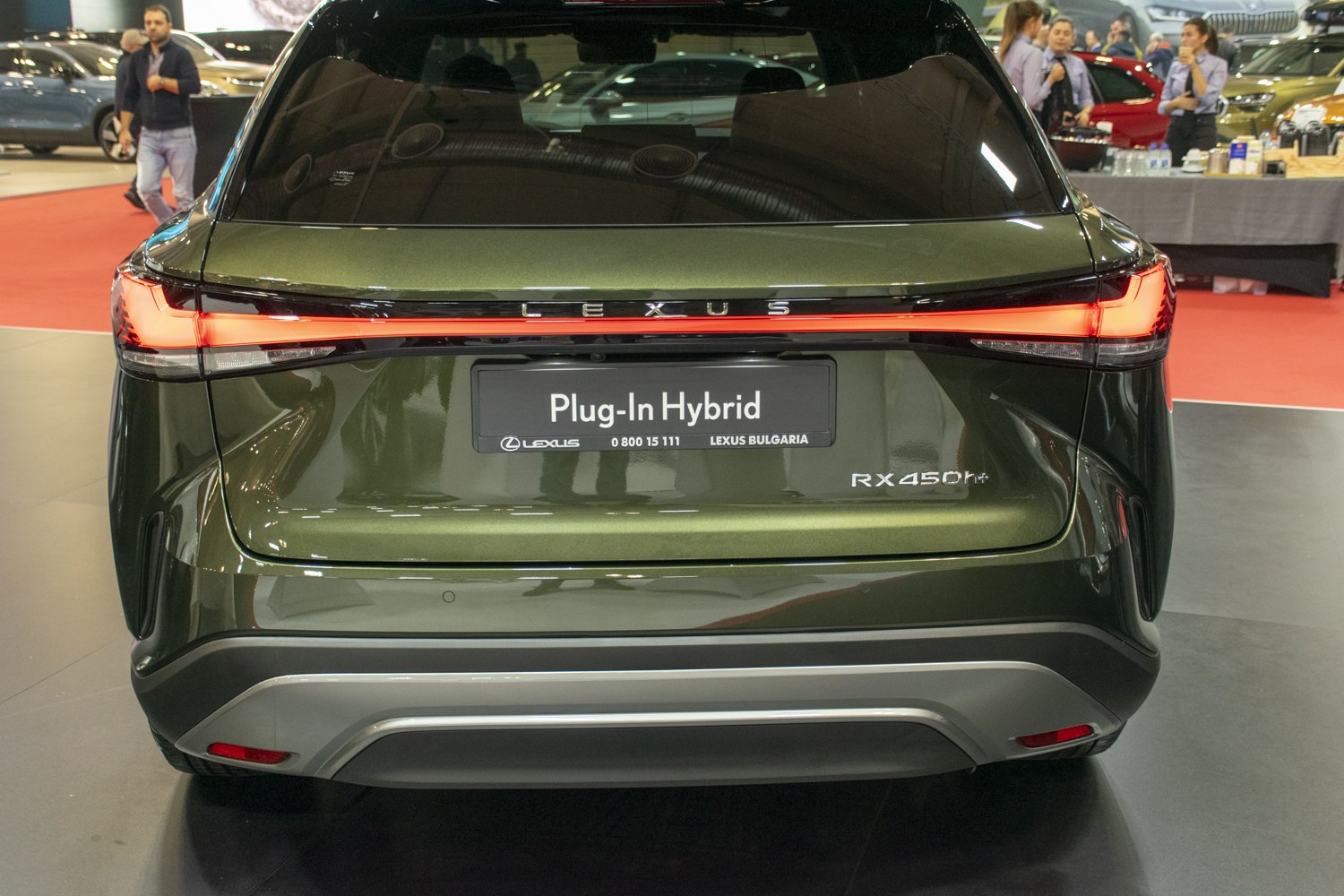 Rear view of SUV with LED tail lights and hybrid badge