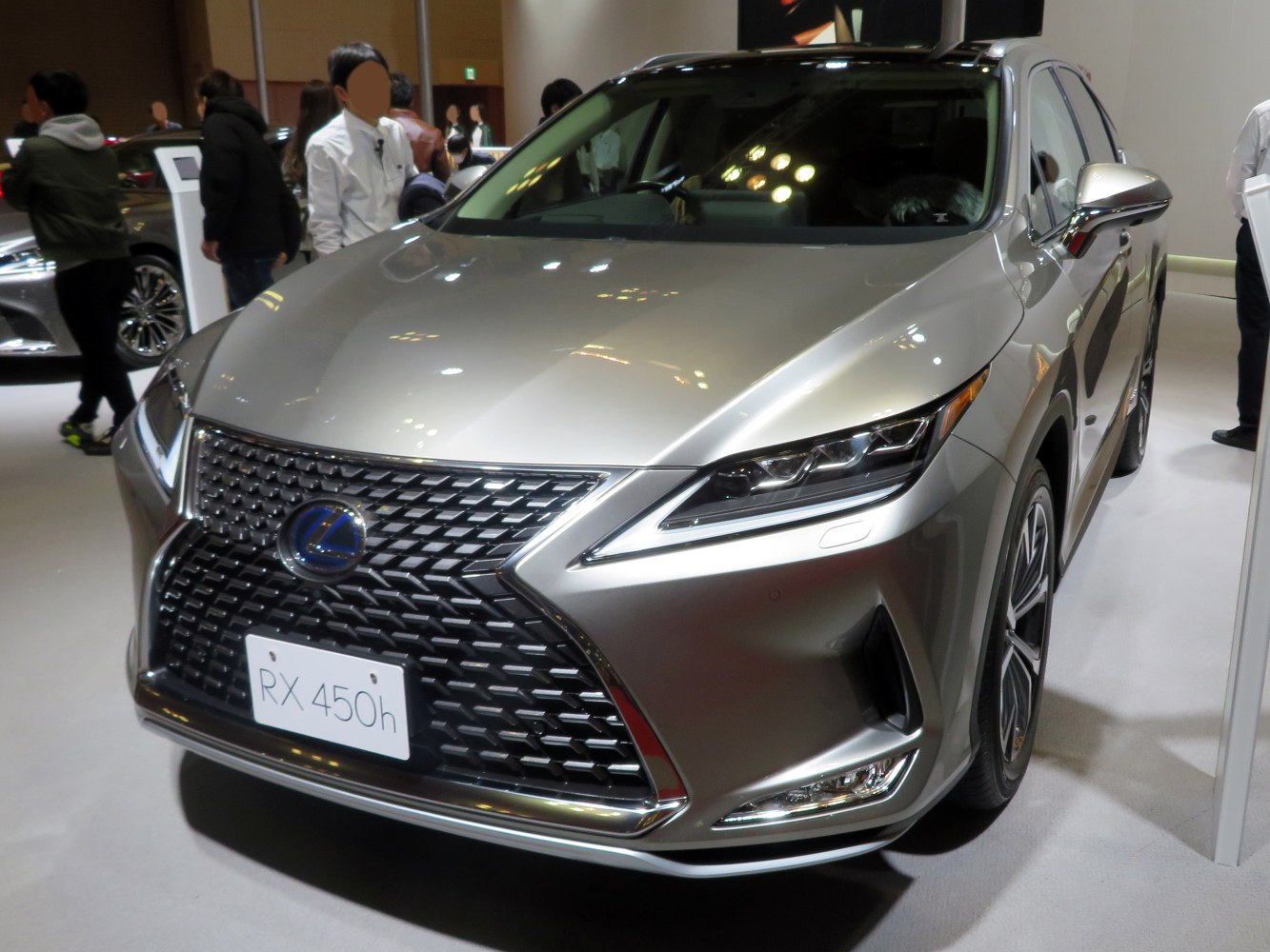 Front close-up of luxury SUV grille and headlights