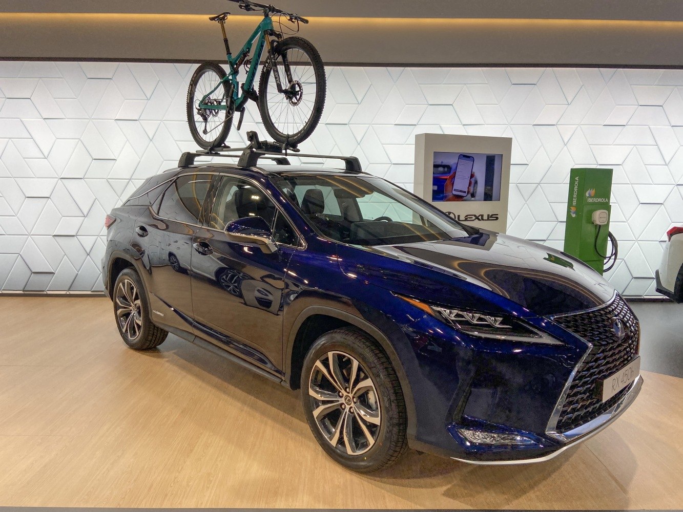 SUV with roof rack and mounted mountain bike