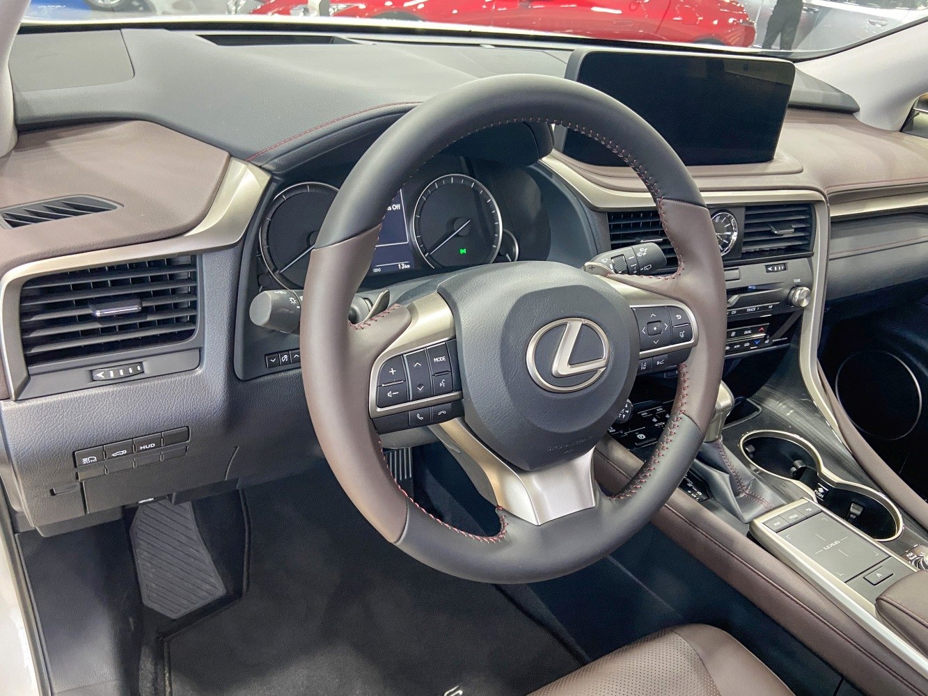 Steering wheel and dashboard with control buttons and digital display