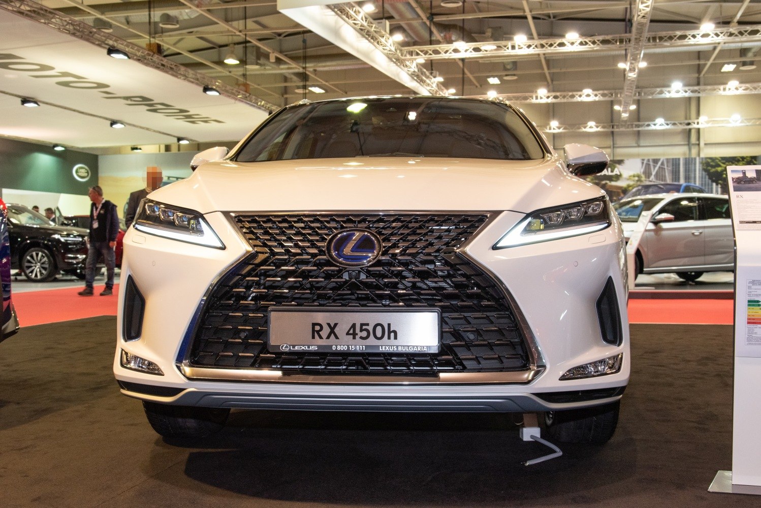 Close-up of bold front grille and sleek LED headlights.