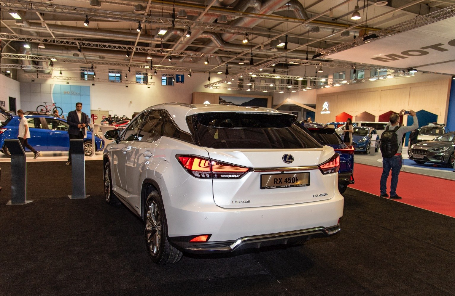 Rear view of modern hybrid SUV with sharp LED taillights and sleek rear styling