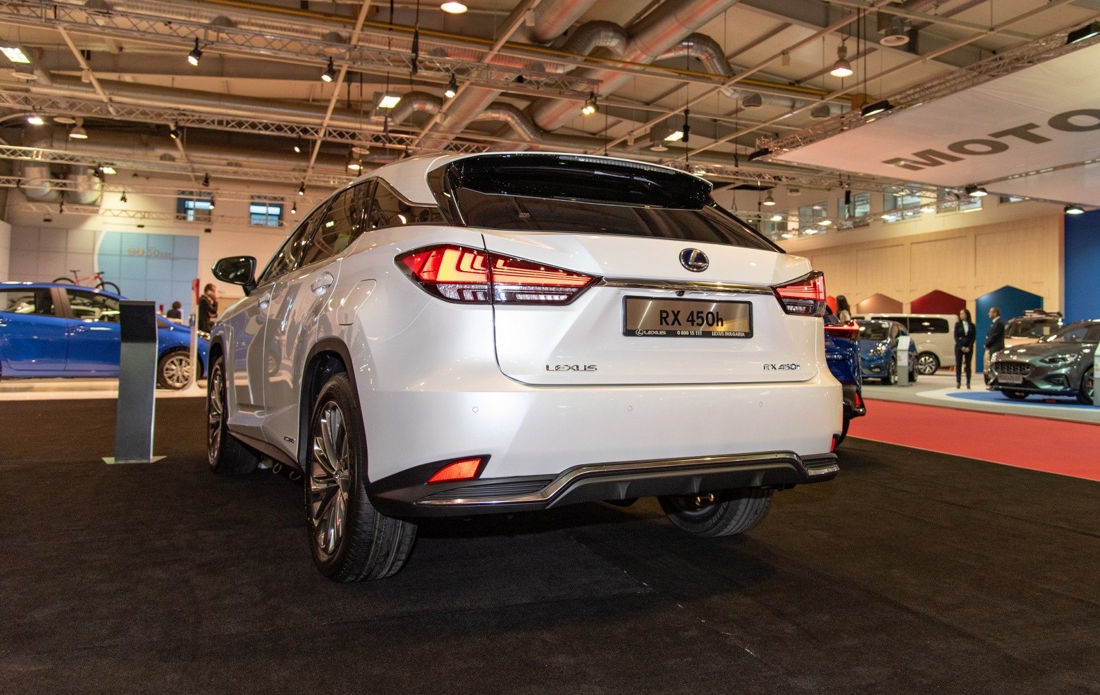 Rear view of hybrid SUV with LED tail lights and facelifted rear design