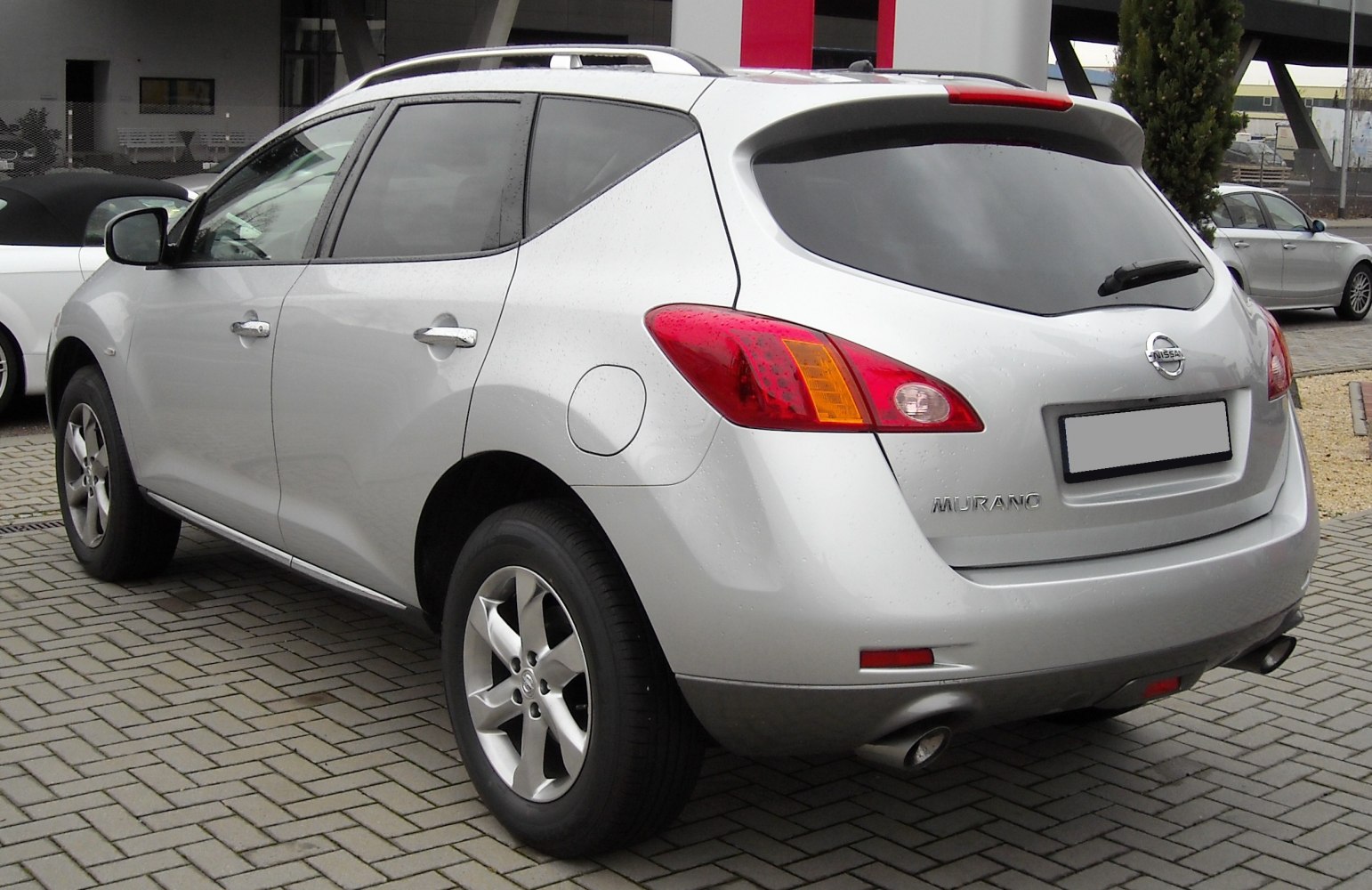 Silver SUV rear side profile with tail lights and alloy wheels