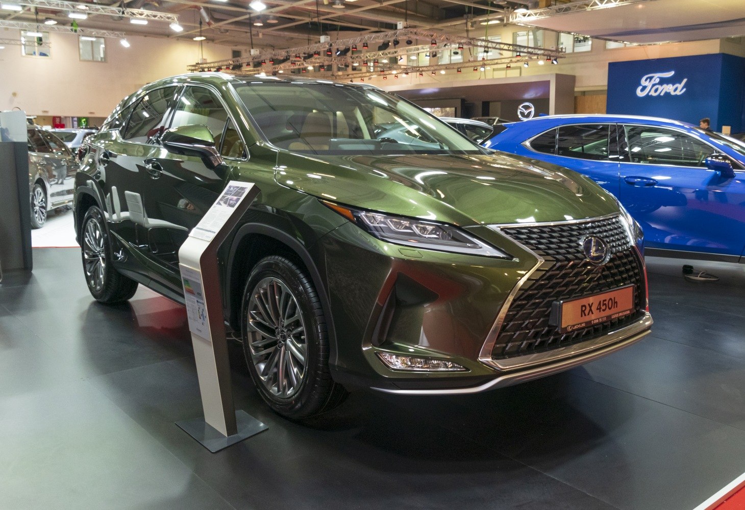 Front angled view of a luxury SUV with prominent grille and modern LED headlights