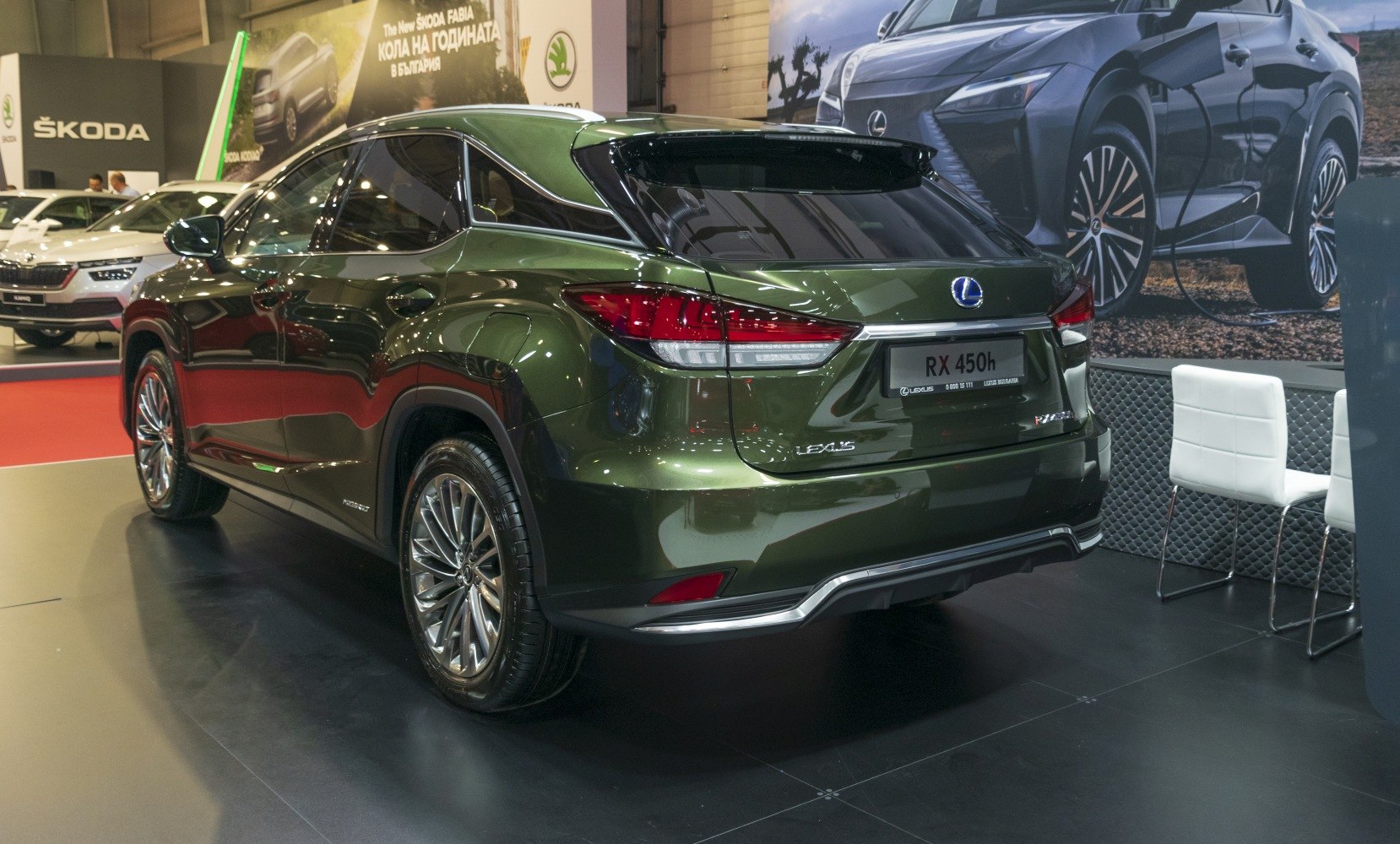 Rear side view of a Lexus hybrid SUV with modern taillights and alloy wheels