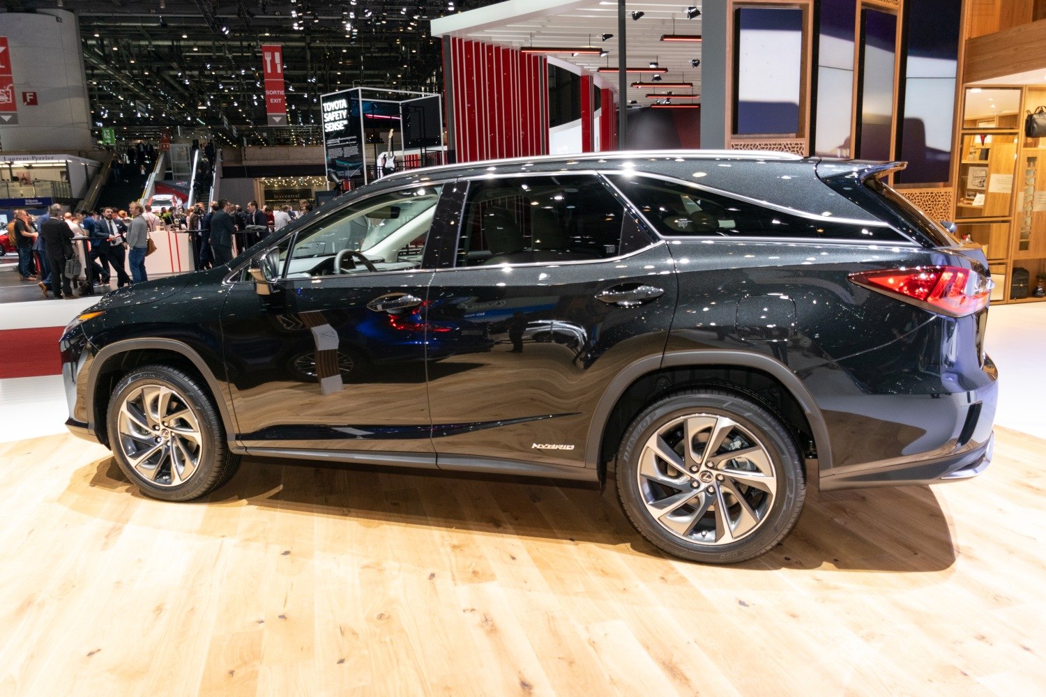 Sleek black hybrid SUV side profile with alloy wheels and sharp rear lights