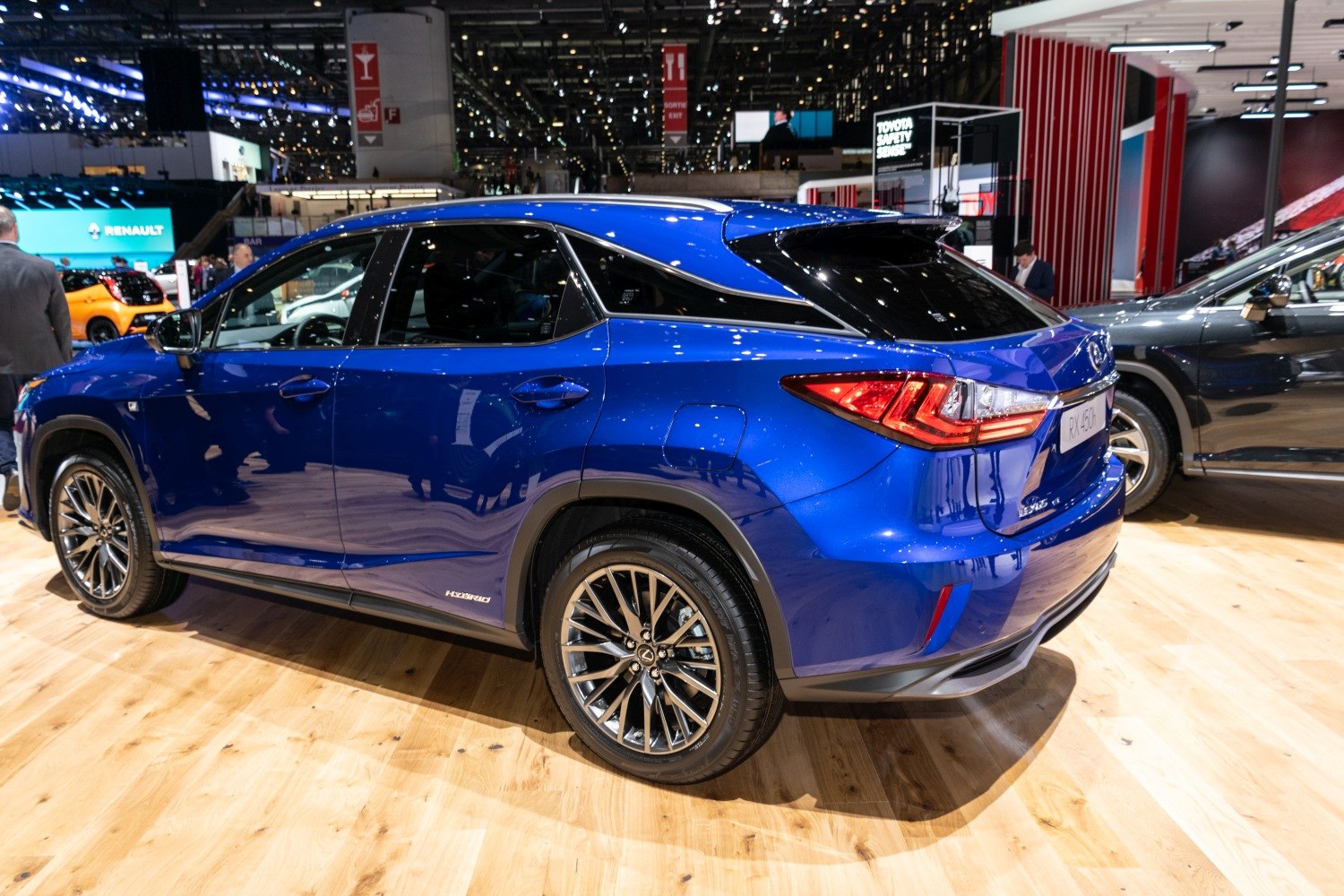 Hybrid SUV rear side profile with sharp tail lights and stylized wheels