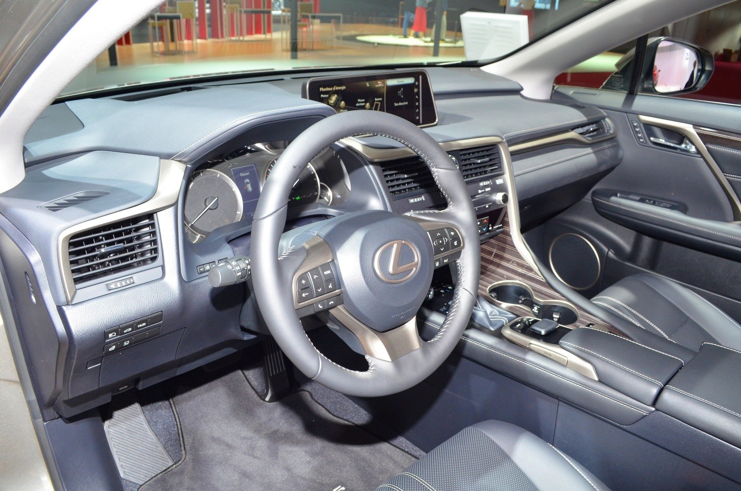 Dashboard, steering wheel, and infotainment system in luxury SUV interior
