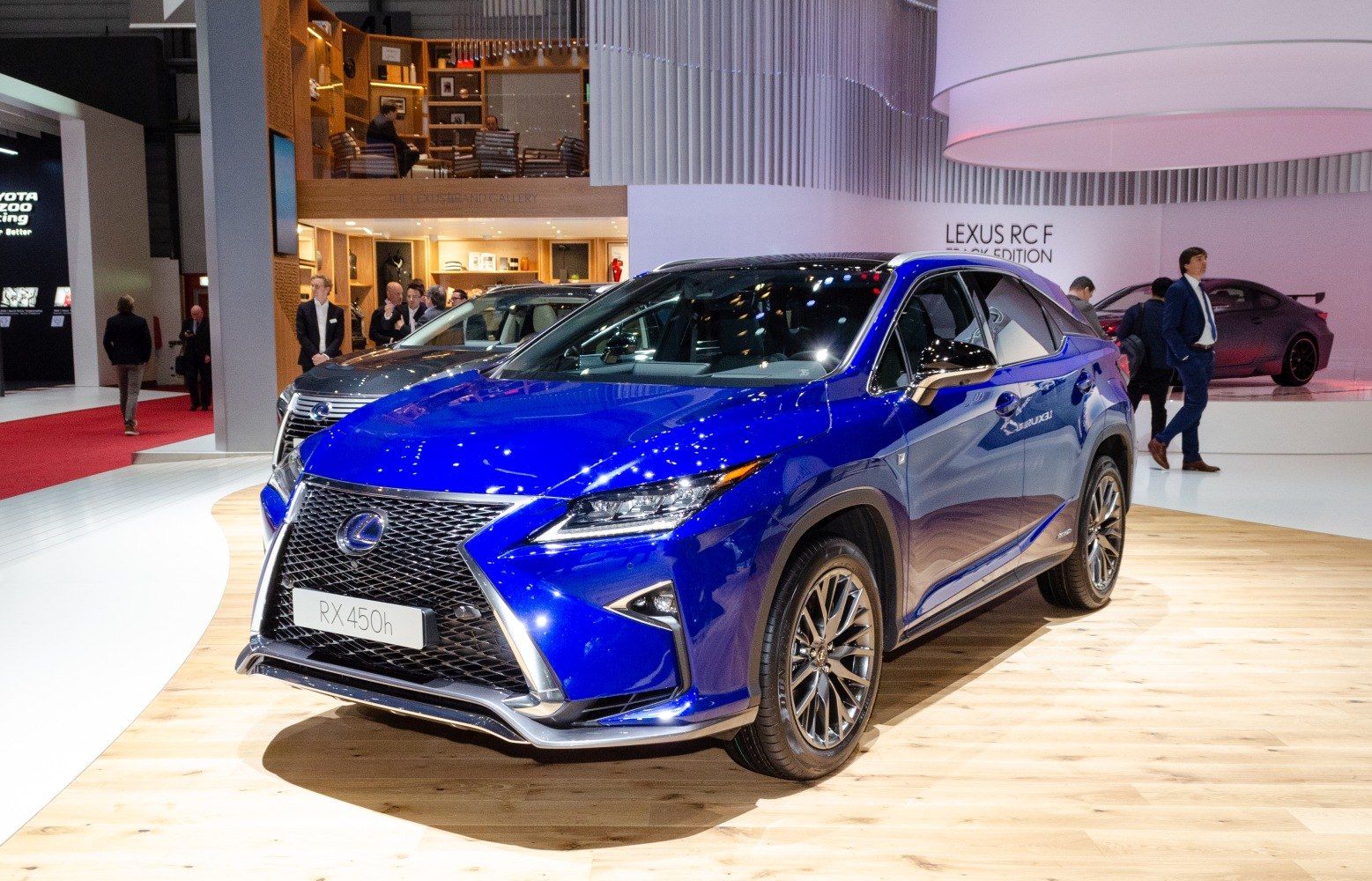 Blue mid-size luxury SUV front-side with spindle grille and sharp LED headlights