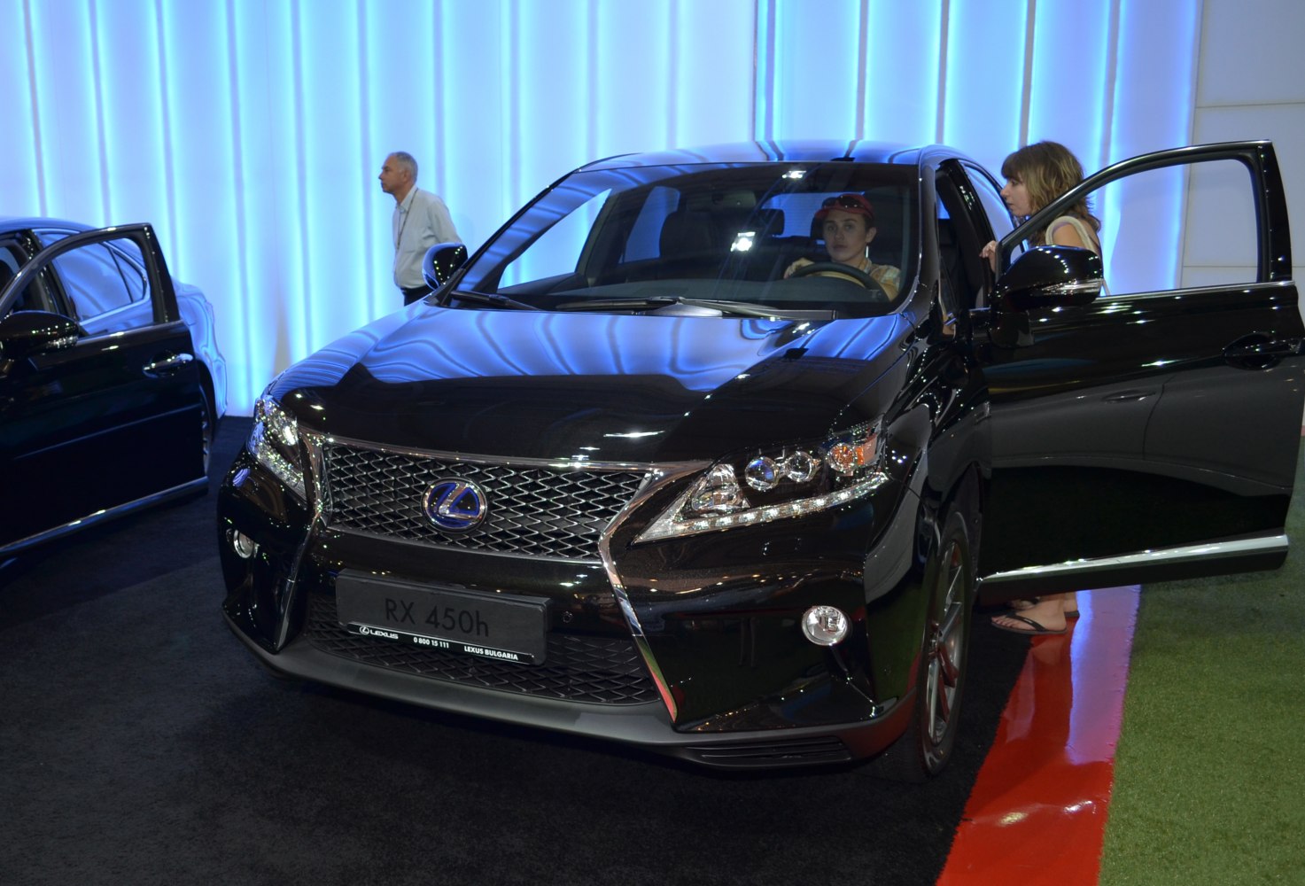 Front grille and LED headlights of a black luxury SUV