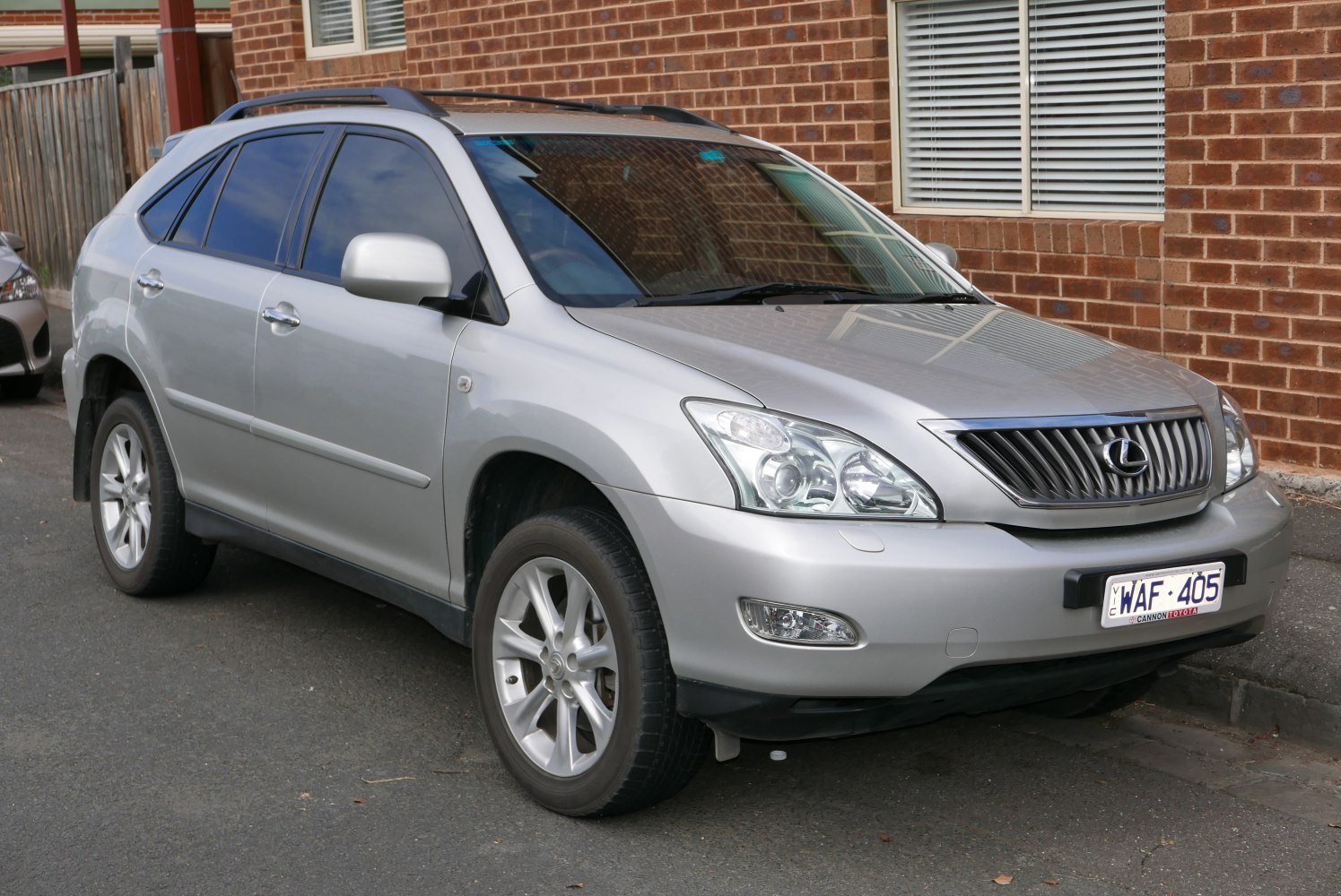 Silver SUV front-side profile with alloy wheels and distinct headlights