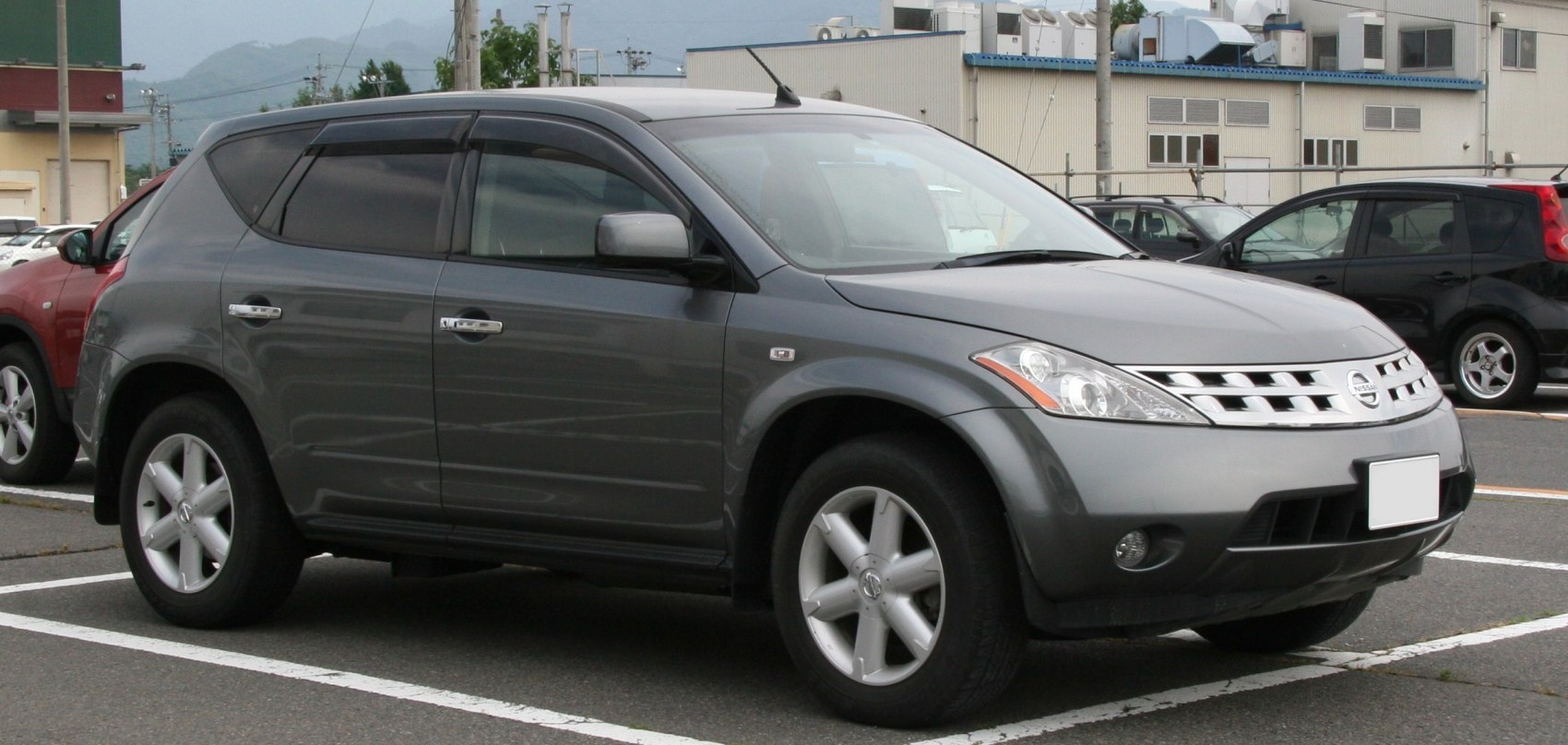 Front side view of a gray mid-size SUV with alloy wheels