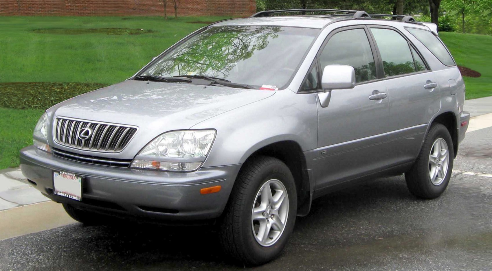 Silver SUV front side view with roof rails and alloy wheels