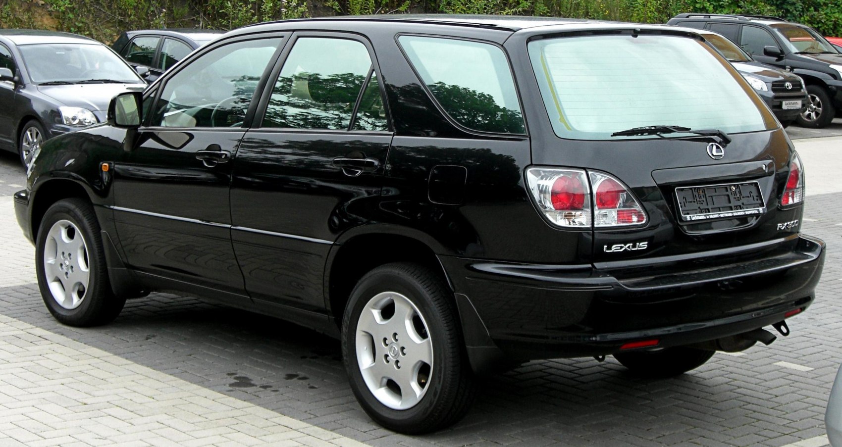 Rear side view of a black SUV with distinct tail lights and smooth body contours