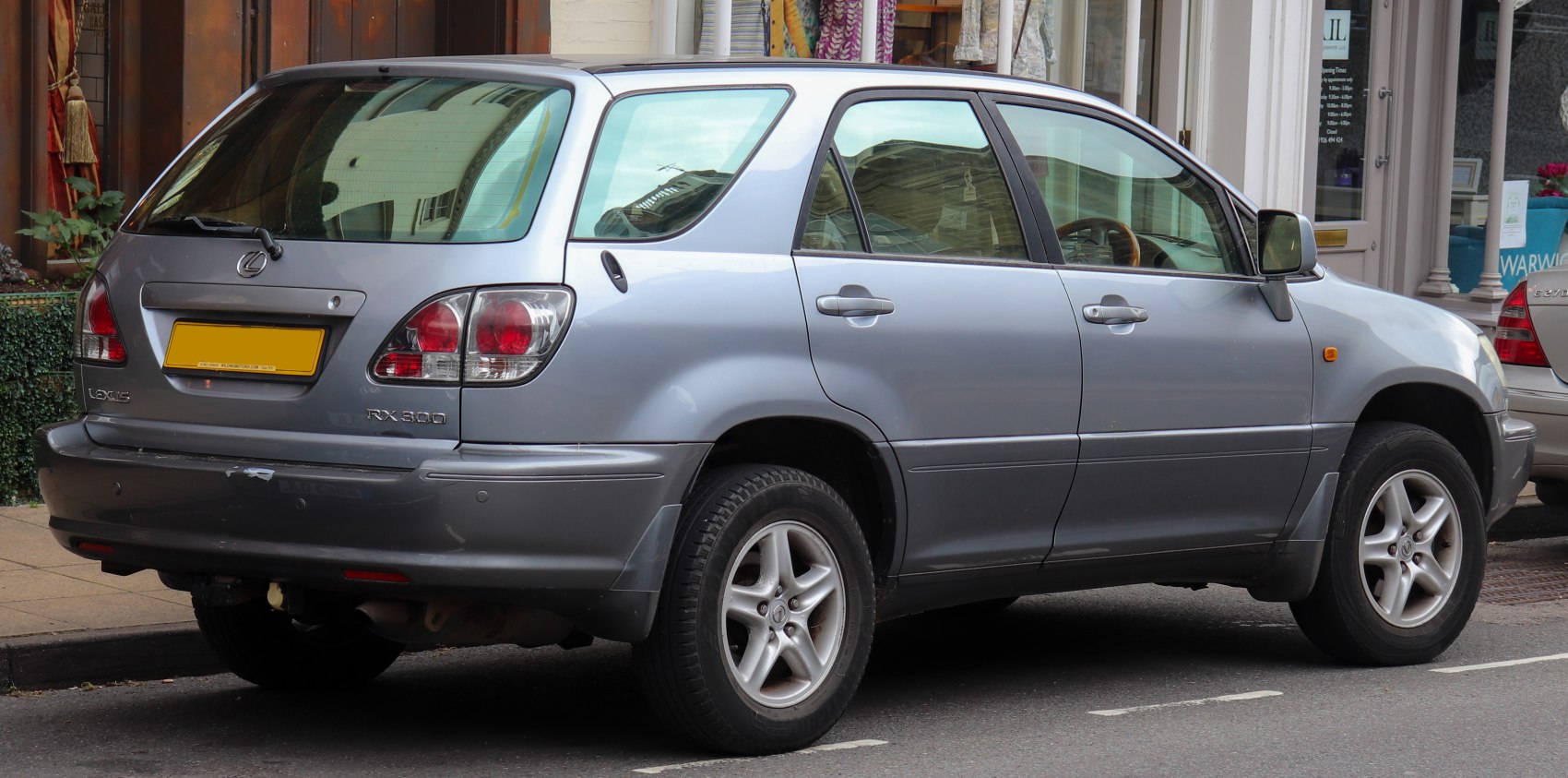 Rear-side view with tail lights and alloy wheels