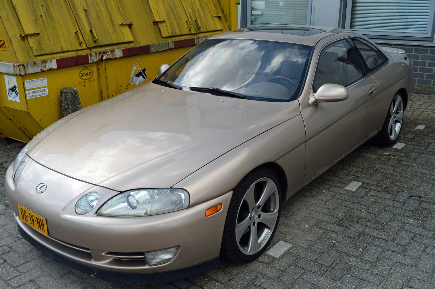 Aerodynamic front view with sleek headlights and alloy wheels