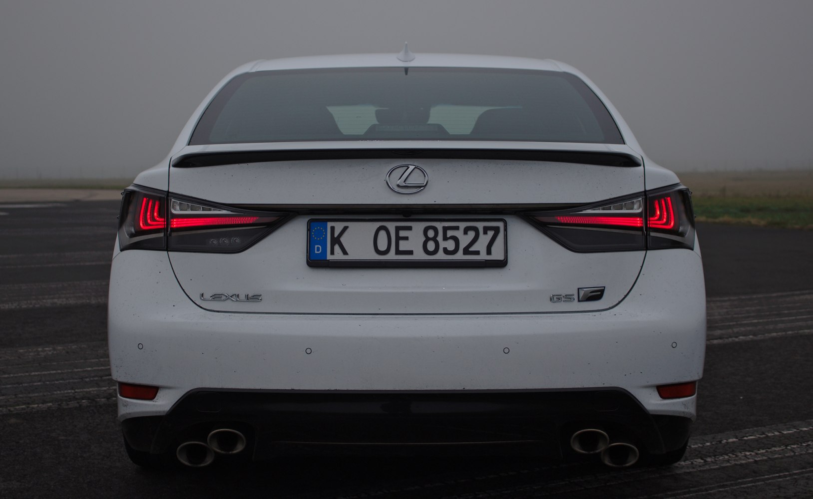 Rear view with distinctive LED tail lights and quad exhausts