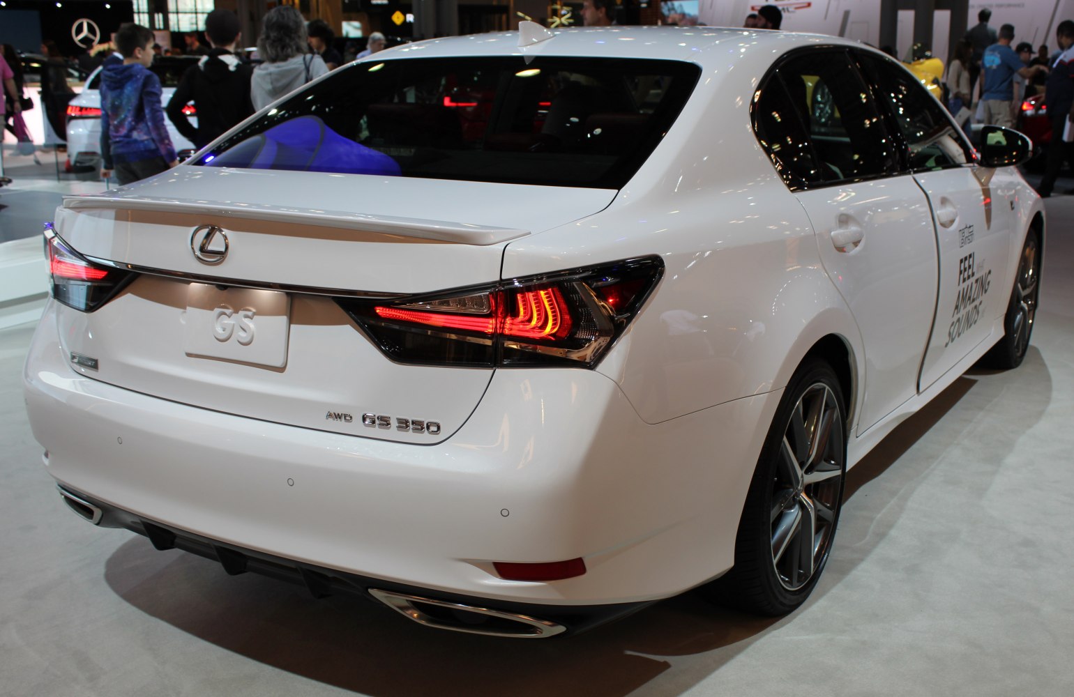 LED taillights and integrated rear spoiler on luxury sedan rear
