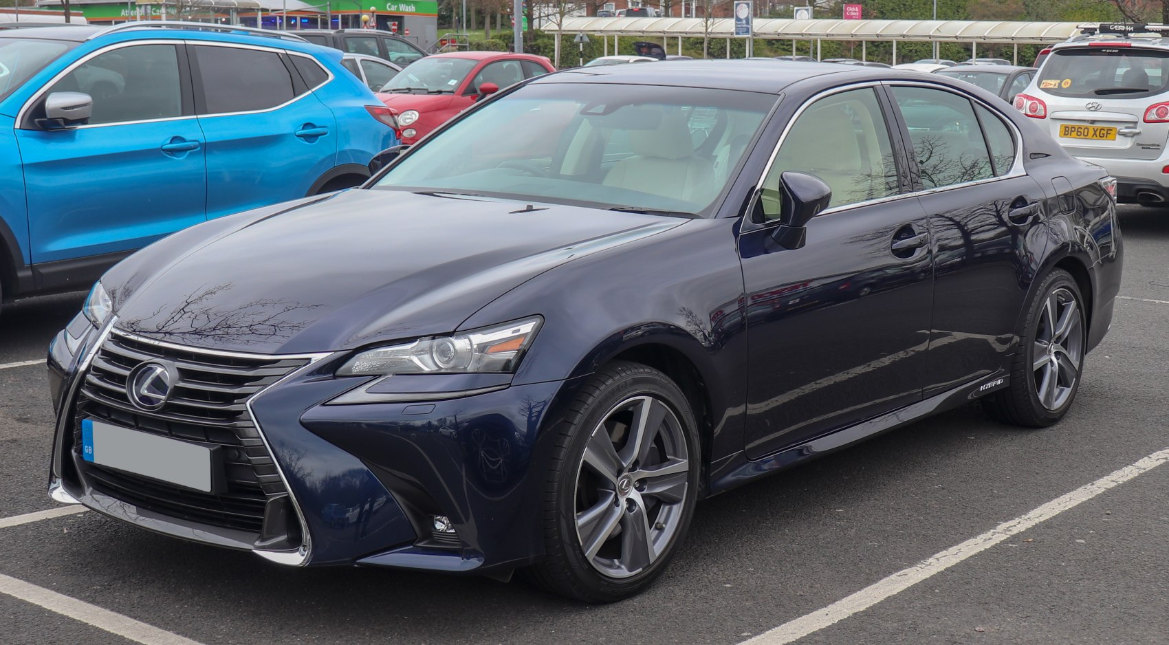 Front and side profile with spindle grille and hybrid badge