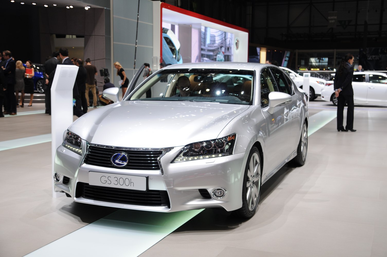 Front view of car with LED headlights and bold grille in showroom