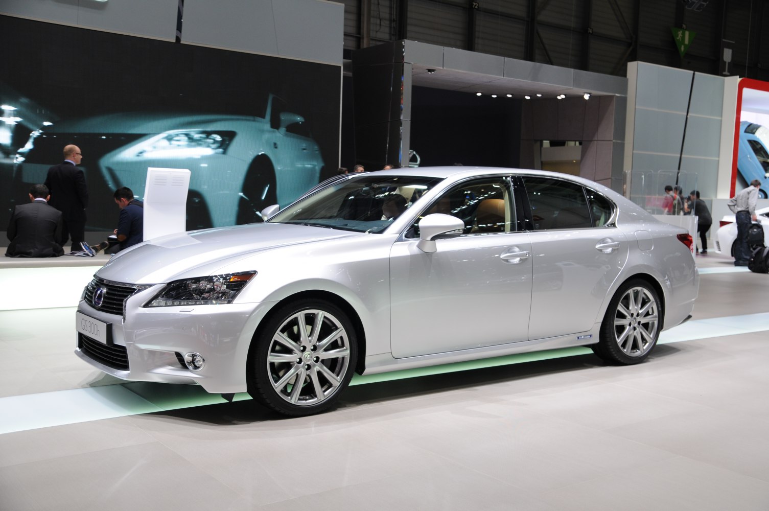 Silver luxury sedan with alloy wheels and LED headlights