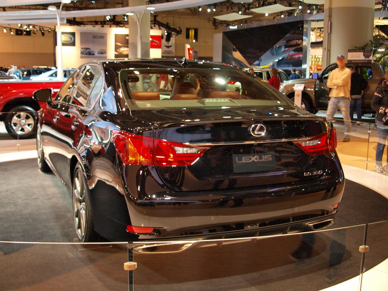 Rear view of luxury sedan with tail lights and dual exhaust