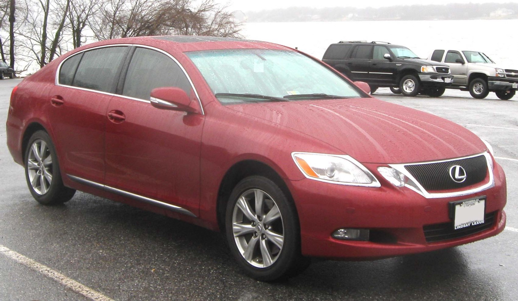 Luxury sedan front side view with alloy wheels and sleek design