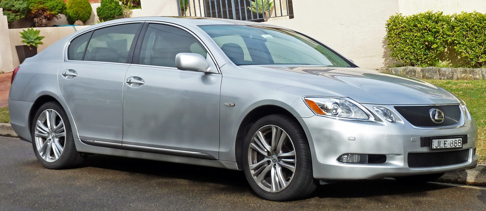 Silver sedan with alloy wheels and sleek body design