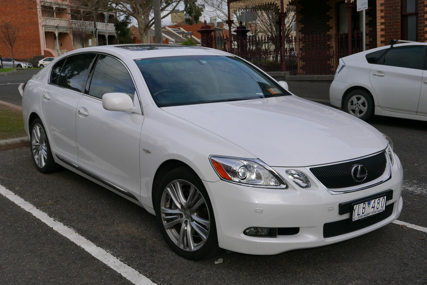 Front side view of luxury sedan with stylish headlights and alloy wheels