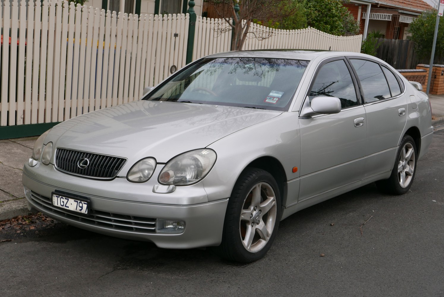 Silver sedan with distinctive oval headlights and front grille