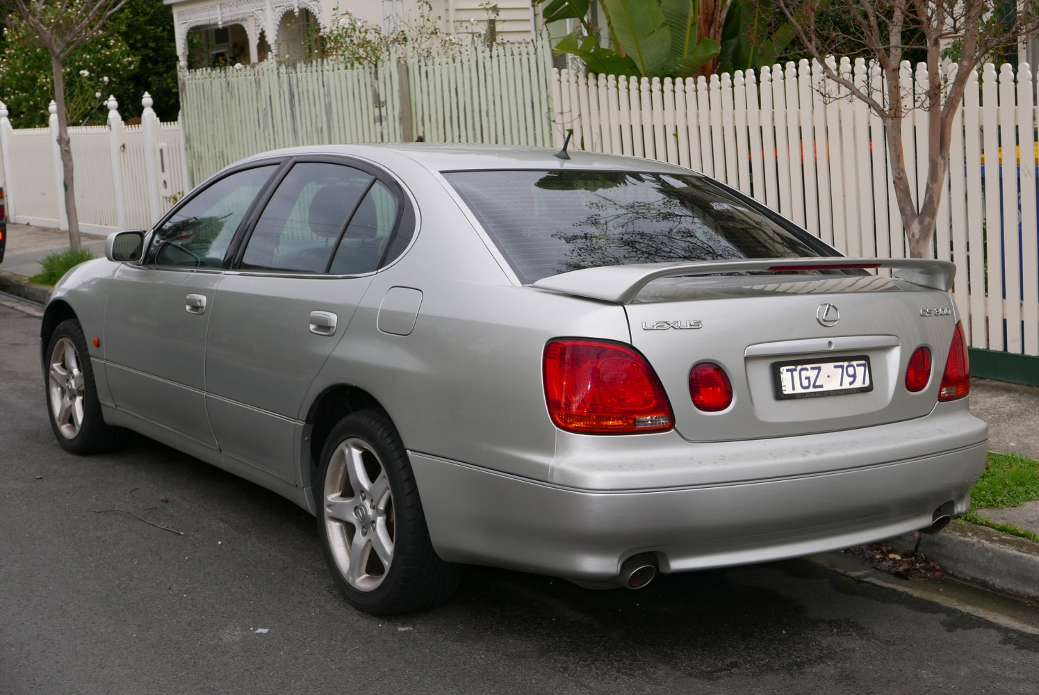 Rear view with spoiler and red tail lights.