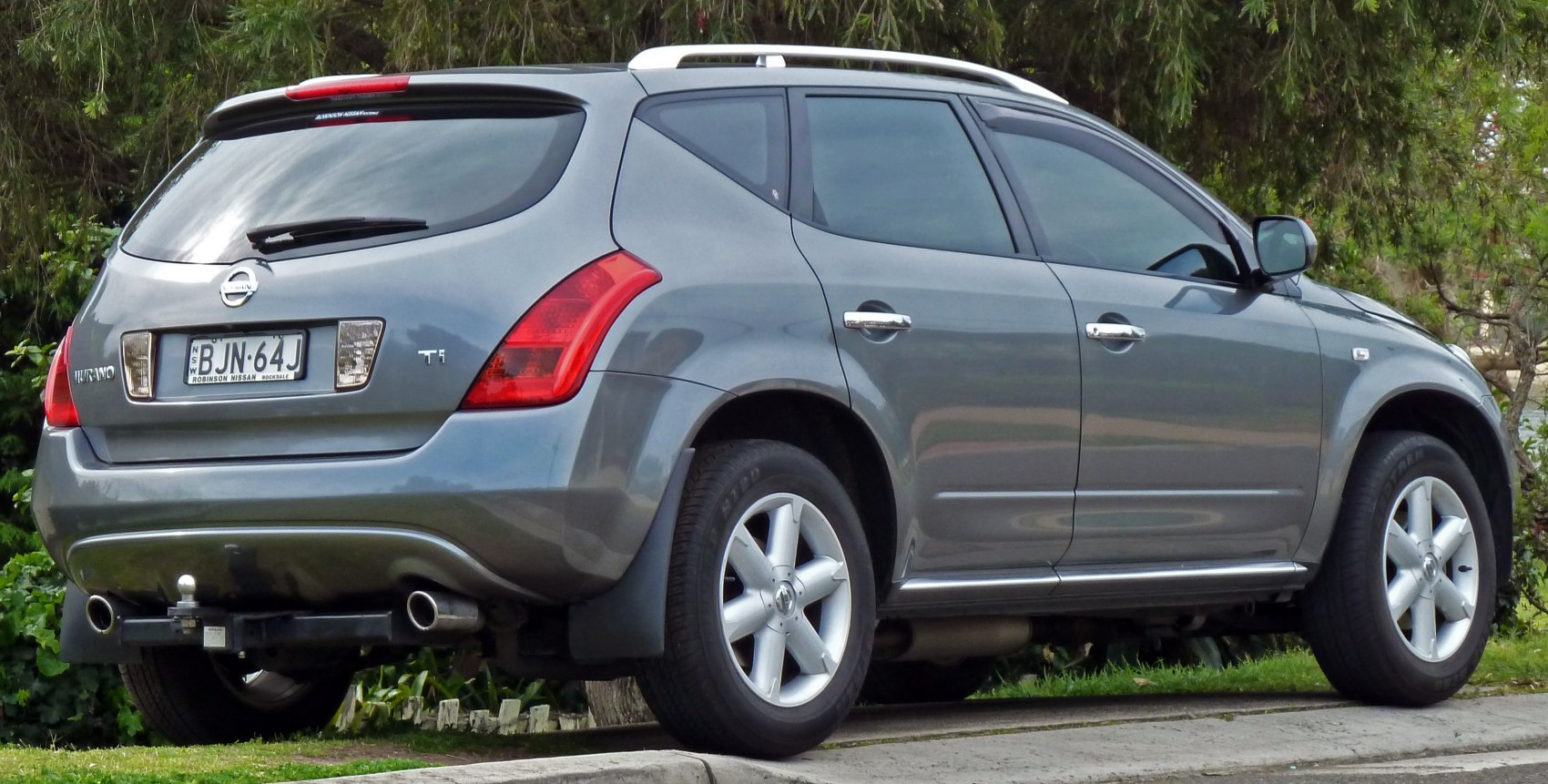 SUV with alloy wheels, roof rails, tinted windows, rear wiper