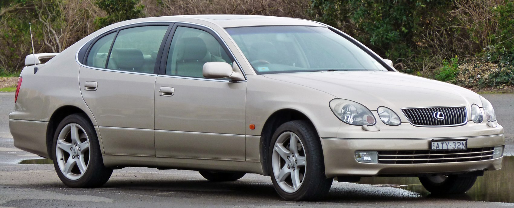 Side view of mid-size luxury sedan with alloy wheels and smooth shape
