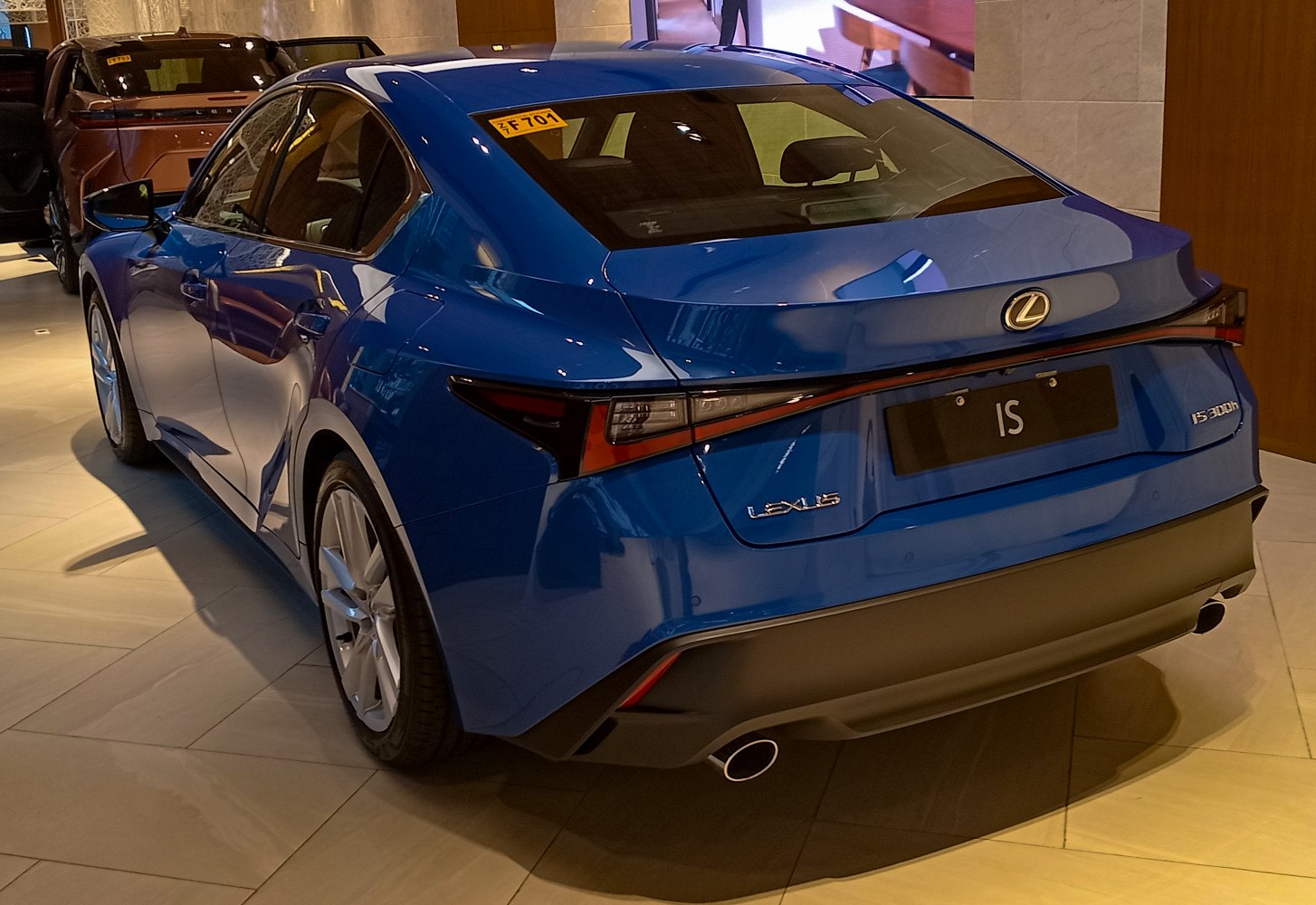 Rear view of a luxury sedan with sharp taillights and dual exhausts