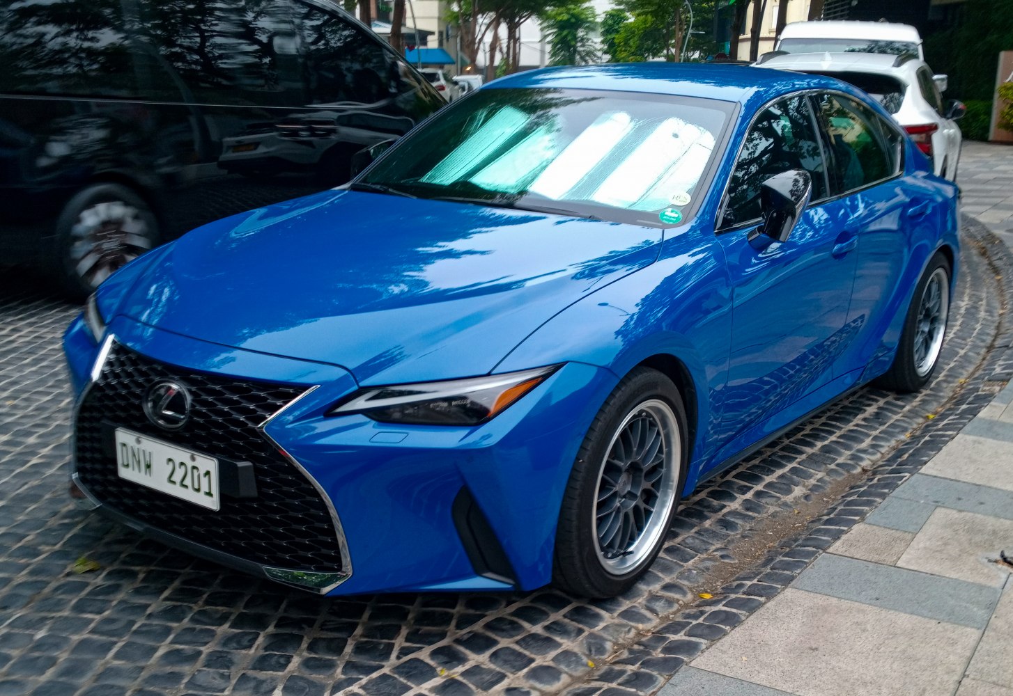 Blue sedan with spindle grille and angular headlights