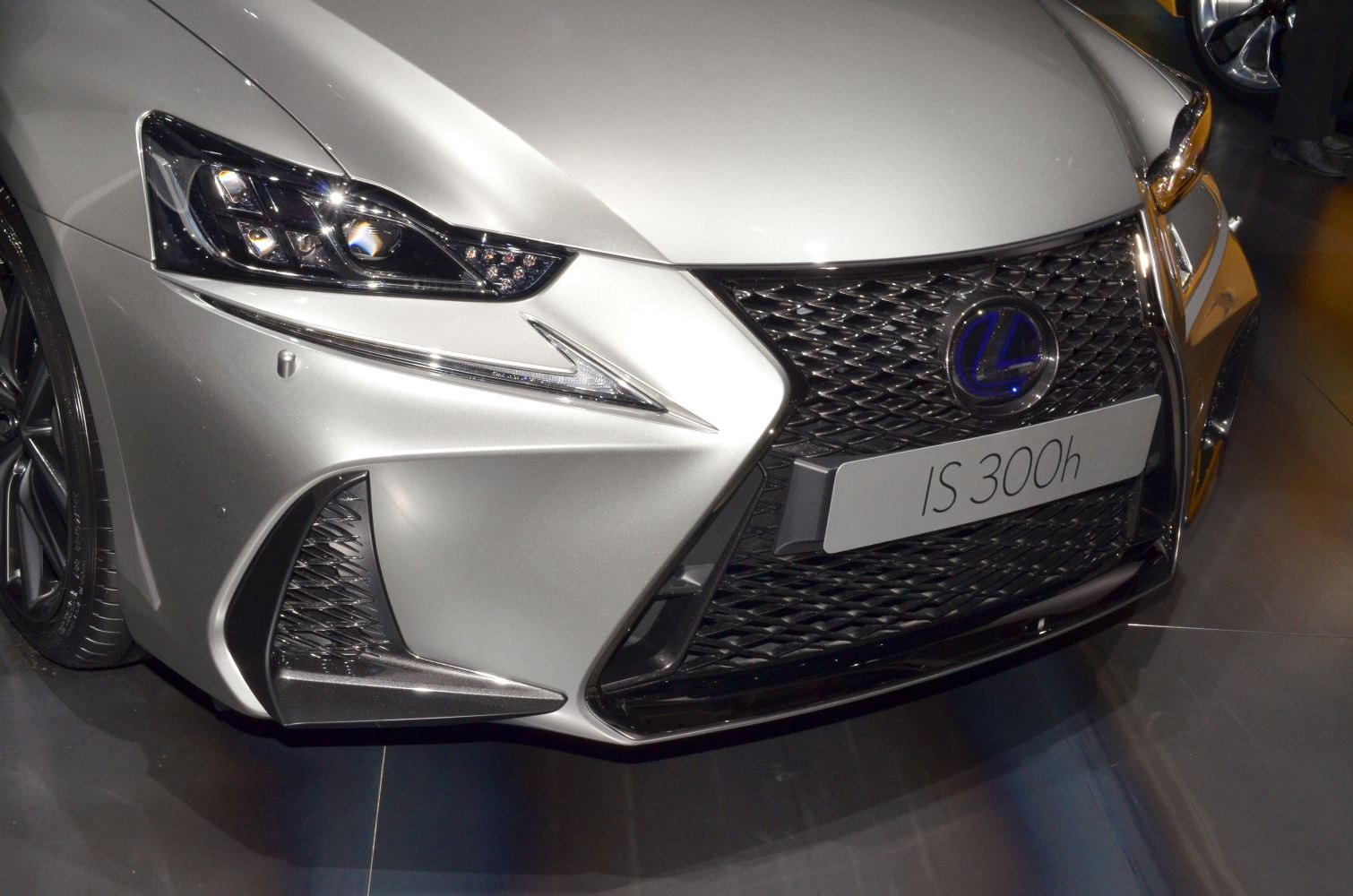 Close-up of front grill and LED headlights of a facelifted luxury sedan