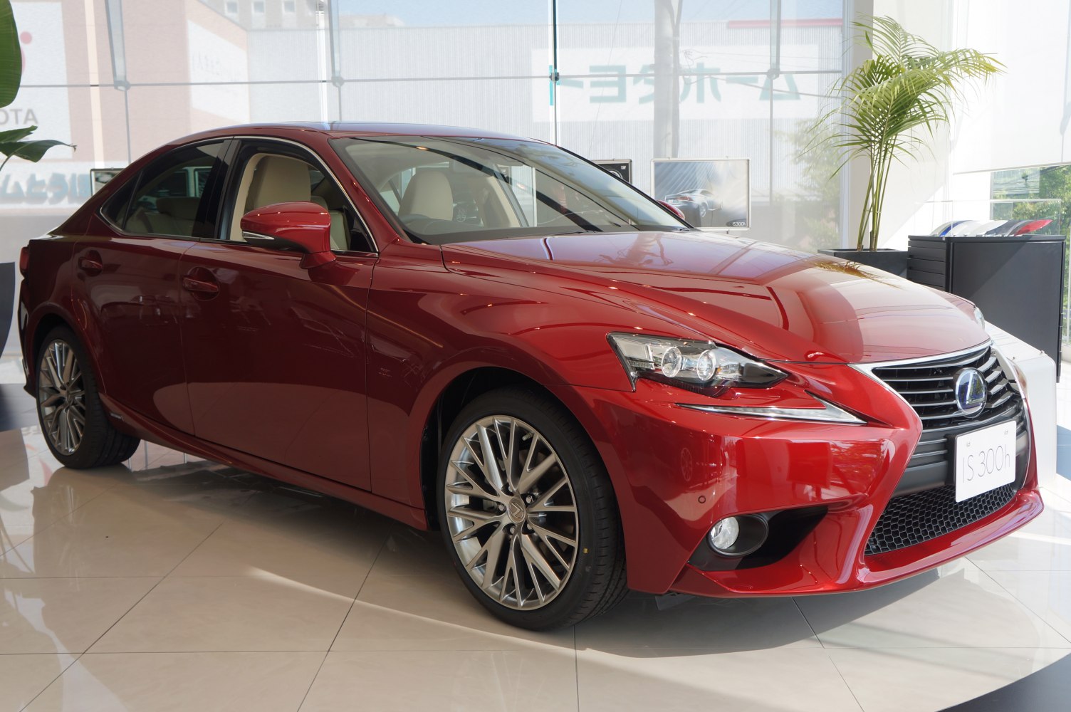 Front and side view of a sporty sedan with alloy wheels