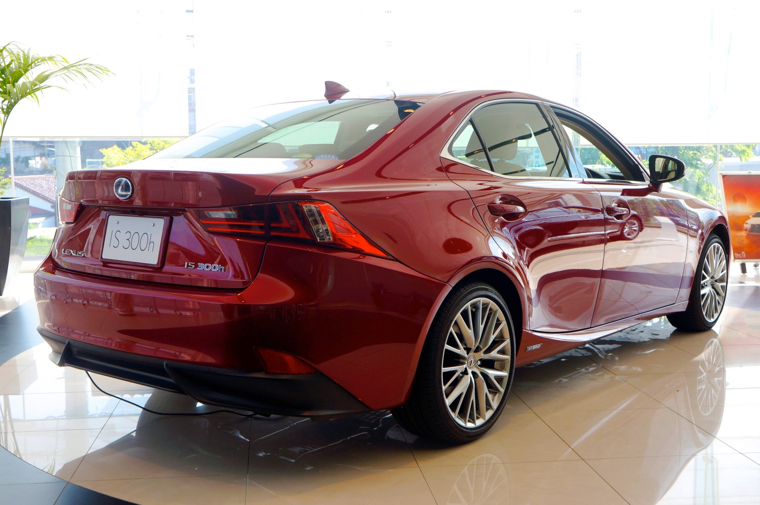Rear view of a sleek hybrid sedan with distinctive taillights and alloy wheels