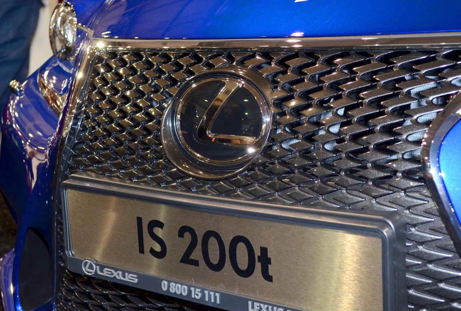 Detailed close-up of car front grille and emblem