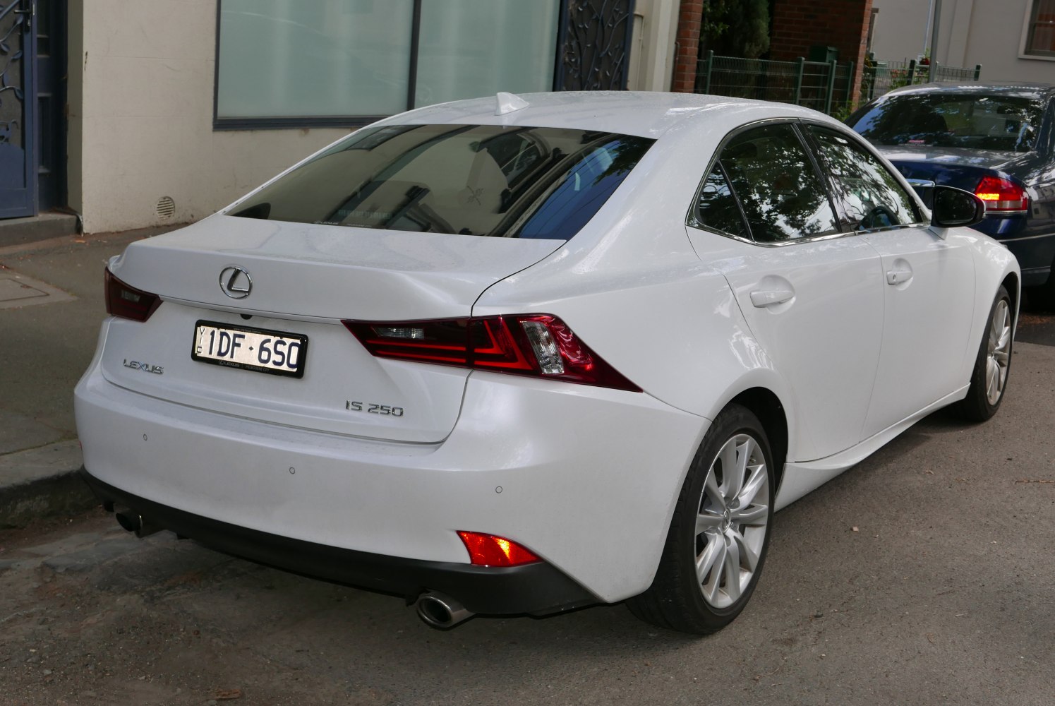 Rear side view with tail lights and exhaust pipe